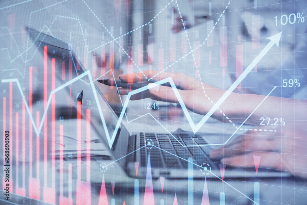 Multi exposure of woman hands typing on computer and financial graph hologram drawing. Stock market analysis concept. Multi exposure of woman hands typing on computer and financial graph hologram drawing. Stock market analysis concept.