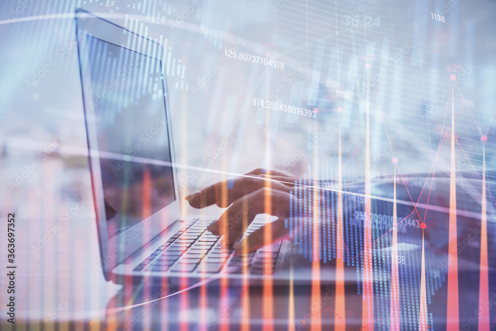 Double exposure of woman hands typing on computer and forex chart hologram drawing. Stock market analysis concept.