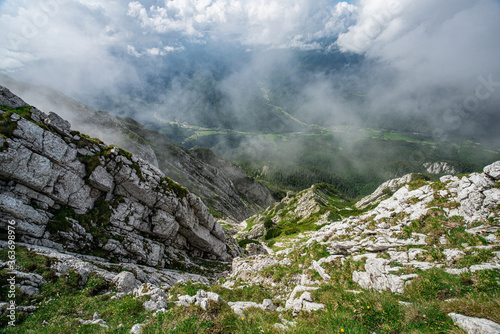 Piatra Craiului Mountains with clouds and sunshine at summer