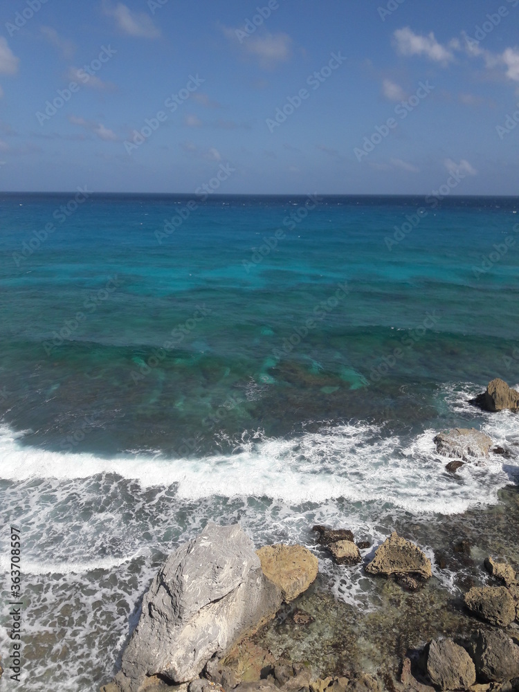Isla Mujeres South Point Cancun Mexico blue water  crashing against rocky shores 2020