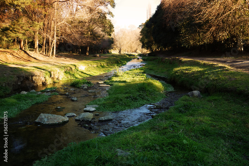 Small creek surrounded big big rocks and a green forest. Located in Villa General Belgrano, Cordoba, Argentina