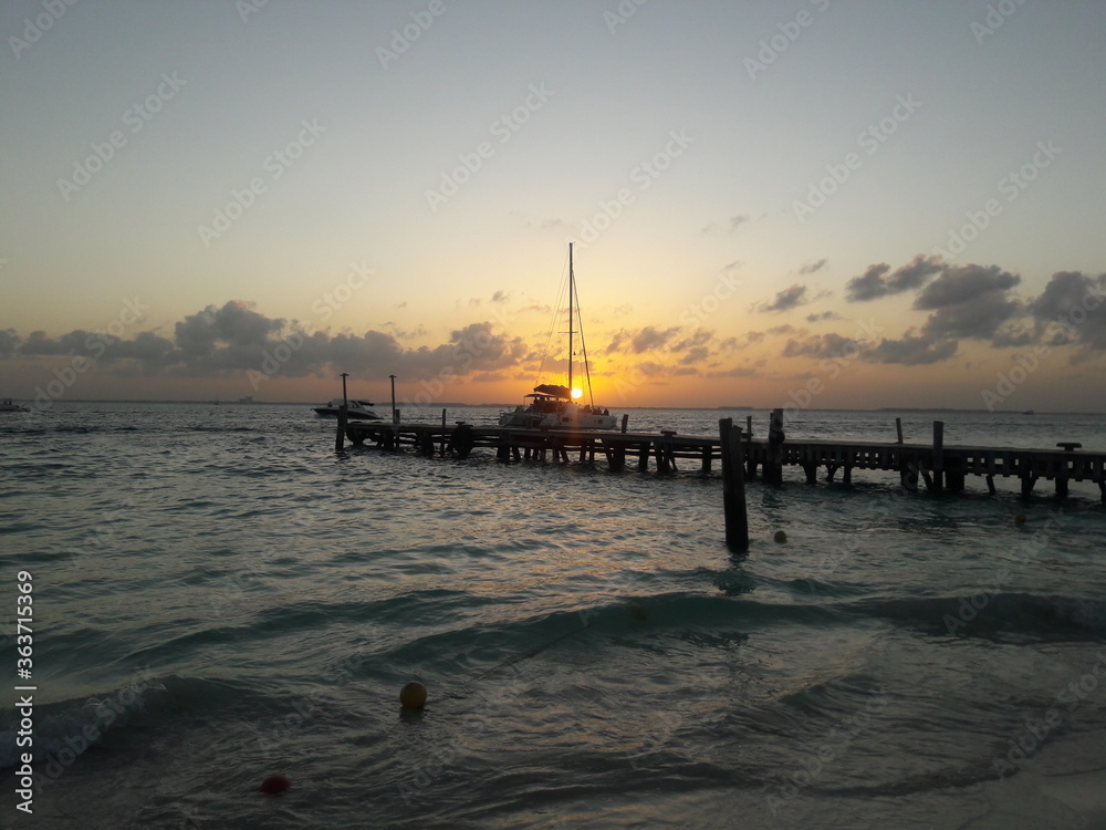 Sunset at beach with a dock on Isla Mujeres Cancun Mexico 2020