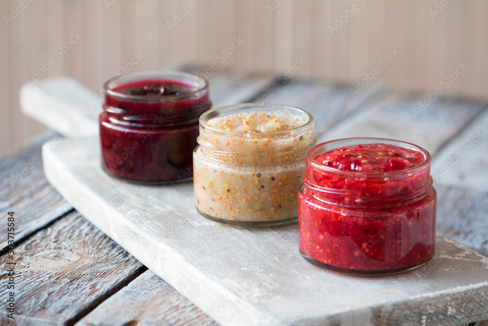 jars of black, red and yellow currant jam