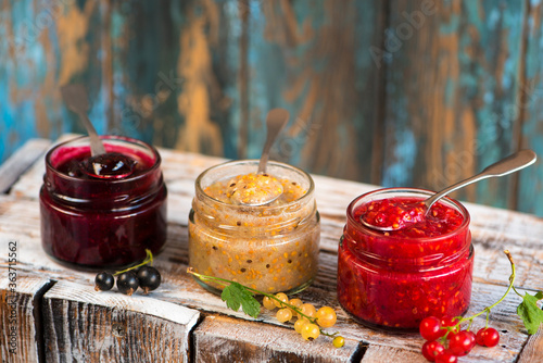 jars of black, red and yellow currant jam