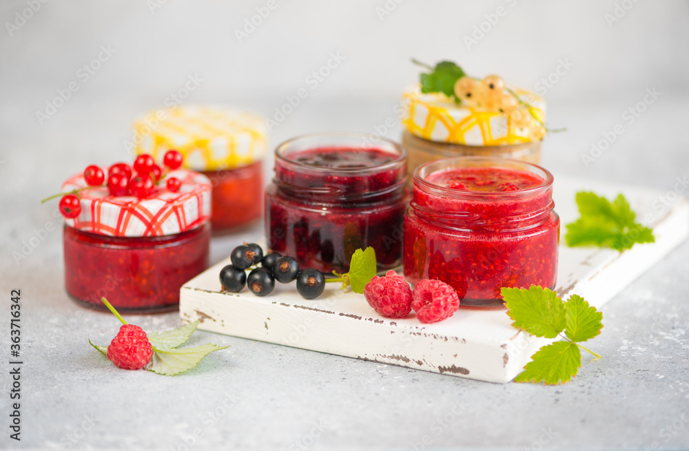 raspberry and currant jam in small jars