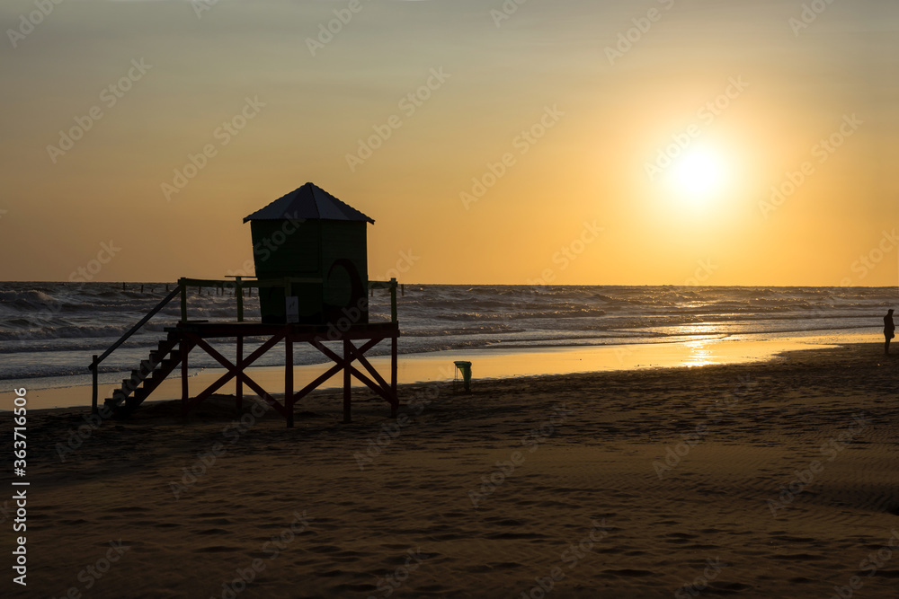 Sunset with rough sea on the beach Sunset with rough sea on the beach