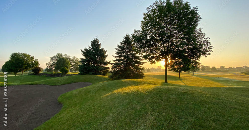 Fototapeta premium sunrise on the golf course sand trap