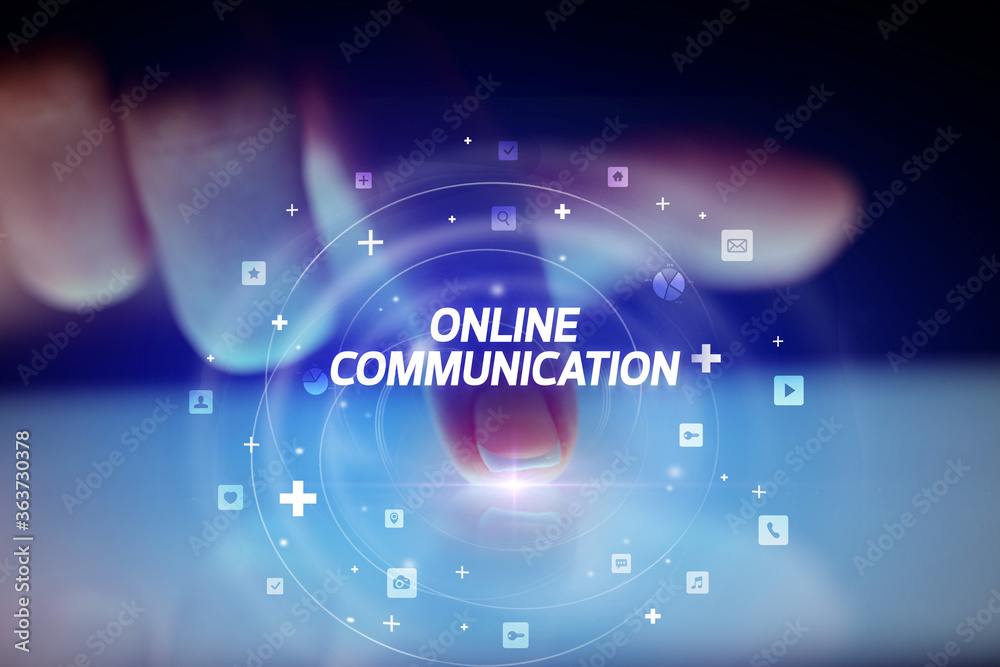Finger touching tablet with social media icons and ONLINE COMMUNICATION Finger touching tablet with social media icons and ONLINE COMMUNICATION