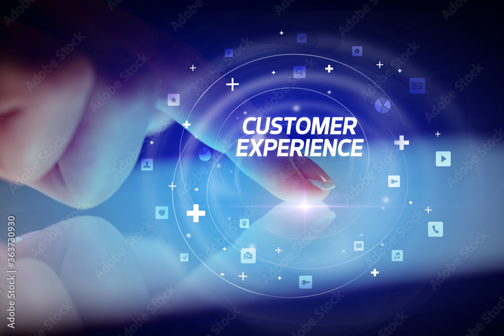 Finger touching tablet with social media icons and CUSTOMER EXPERIENCE Finger touching tablet with social media icons and CUSTOMER EXPERIENCE