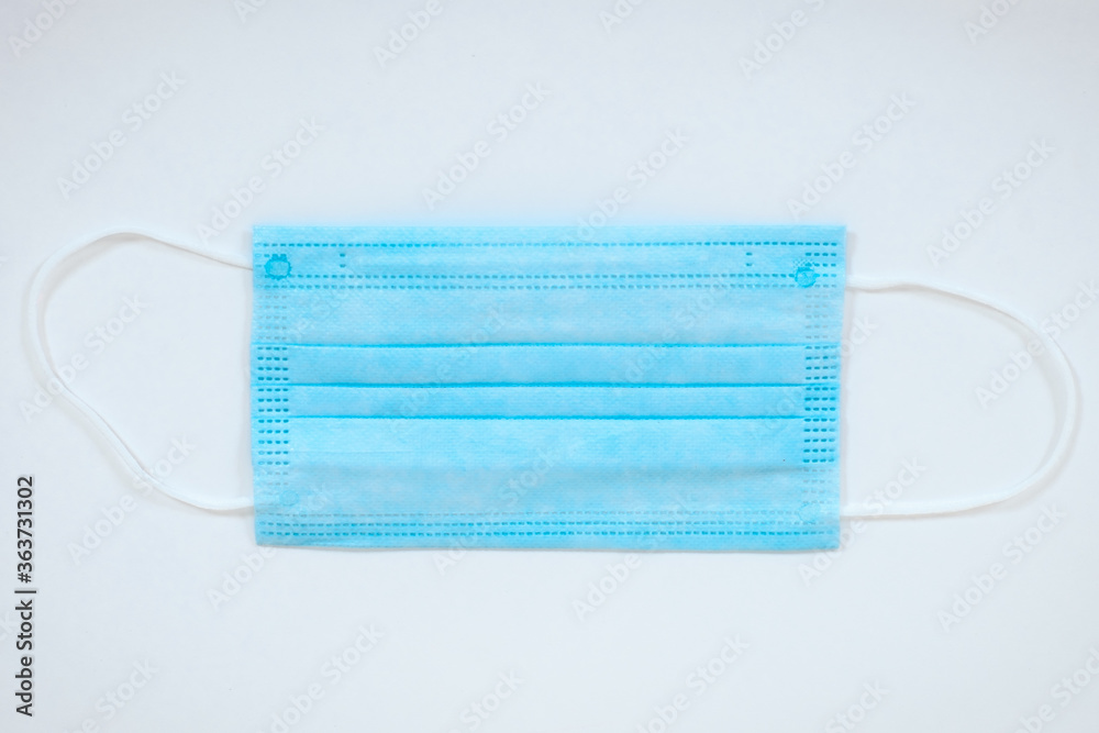 Isolated light blue ear loop mask from top view