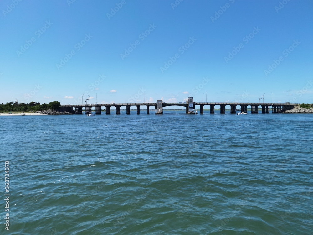 Bridge at the shore, Blue sky with clear water