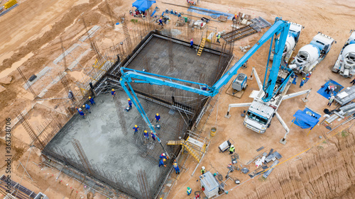 Aerial view construction worker pouring concrete