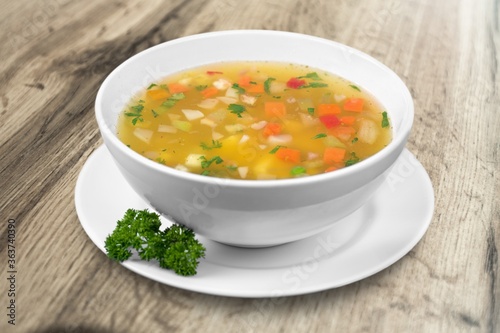 Bowl of delicious vegetable soup on a table