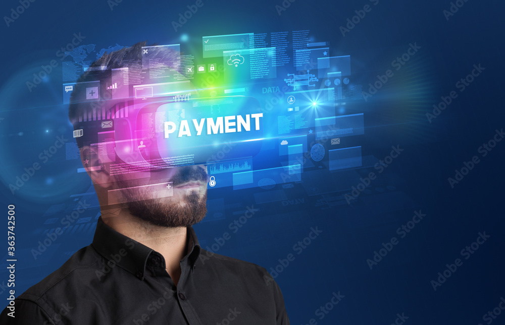 Businessman looking through Virtual Reality glasses with PAYMENT inscription, innovative security concept Businessman looking through Virtual Reality glasses with PAYMENT inscription, innovative security concept