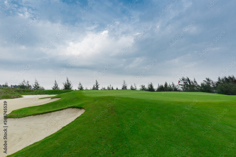 golf course and bunkers with clouds on a gloomy day