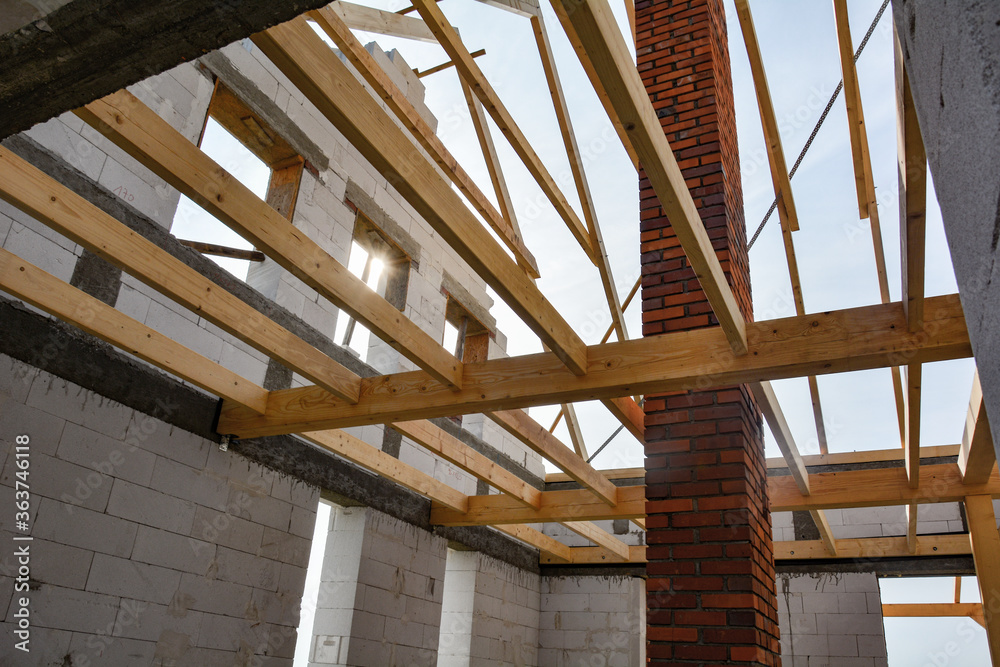 Obraz premium new wooden roof made by roofer