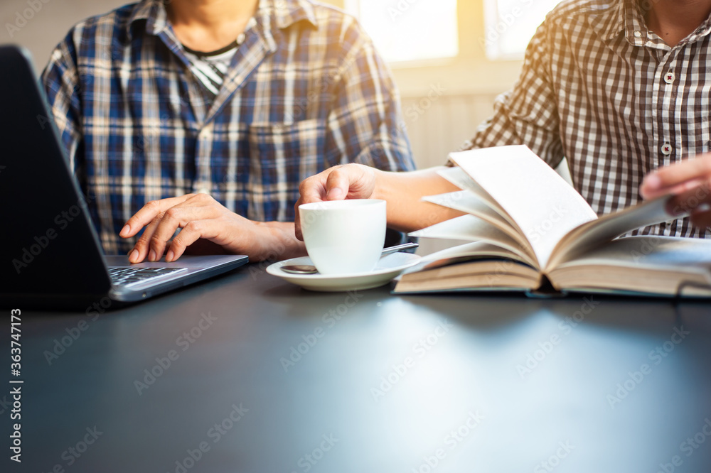 Two young men are studying, searching for information for doing academic projects. Two young men are studying, searching for information for doing academic projects.