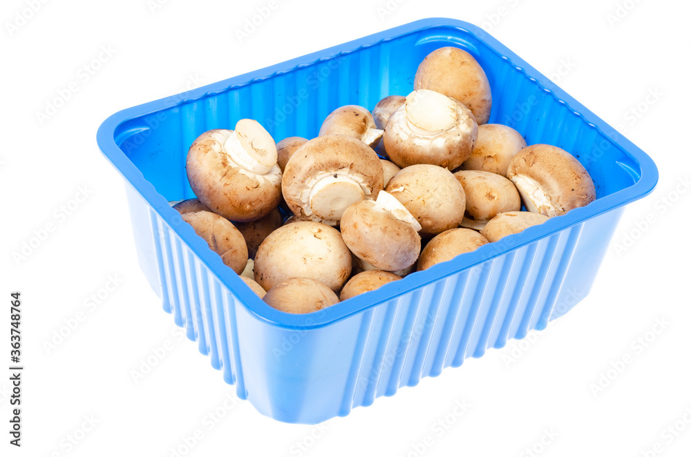 Pack of blue with fresh brown champignons. Pack of blue with fresh brown champignons.