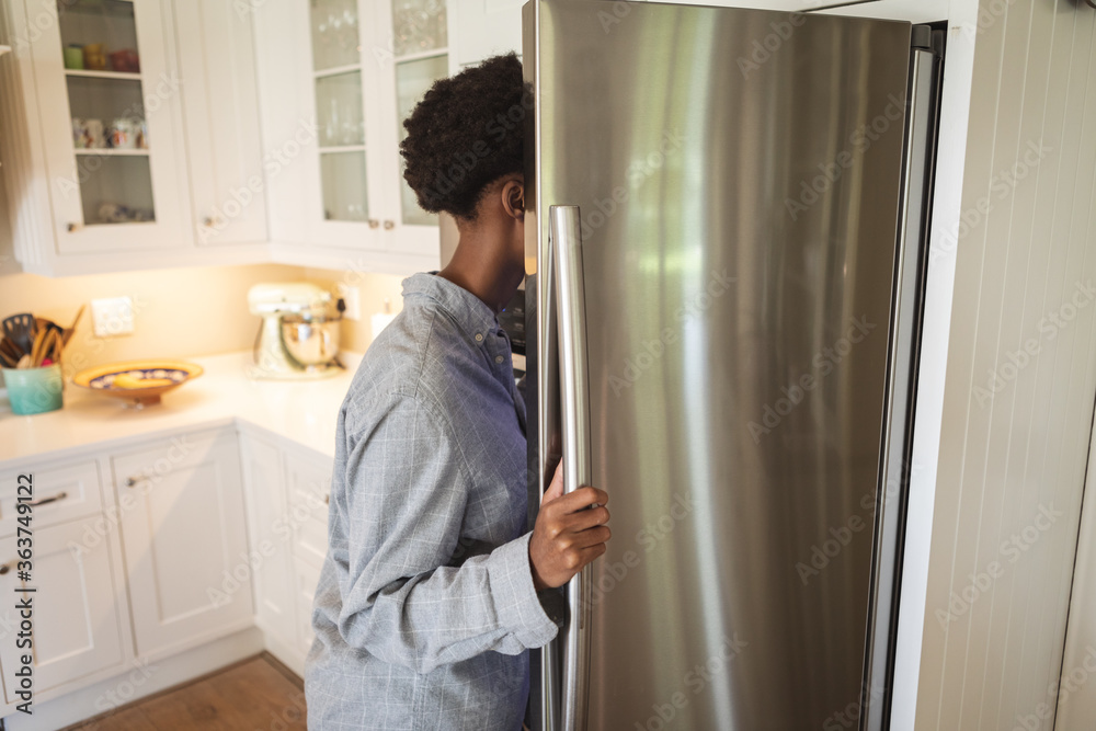 Woman opening the fridge Woman opening the fridge