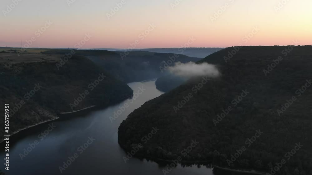 Aerial View of a Calm River Surrounded by Hills With Mist in the Countryside of Ukraine During Sunrise Aerial View of a Calm River Surrounded by Hills With Mist in the Countryside of Ukraine During Sunrise