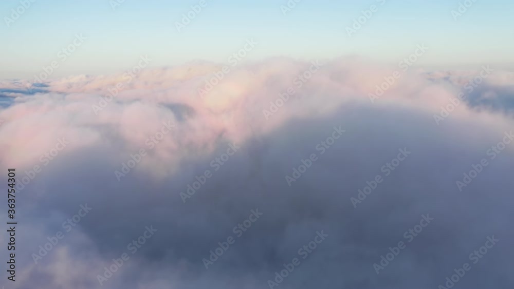4K aerial view from the cockpit. Skyline view from the plane. Pilot cabin front view from the illuminator. Plane is flying through the beautiful pink and blue clouds at the sunrise. Travel by airplane 4K aerial view from the cockpit. Skyline view from the plane. Pilot cabin front view from the illuminator. Plane is flying through the beautiful pink and blue clouds at the sunrise. Travel by airplane