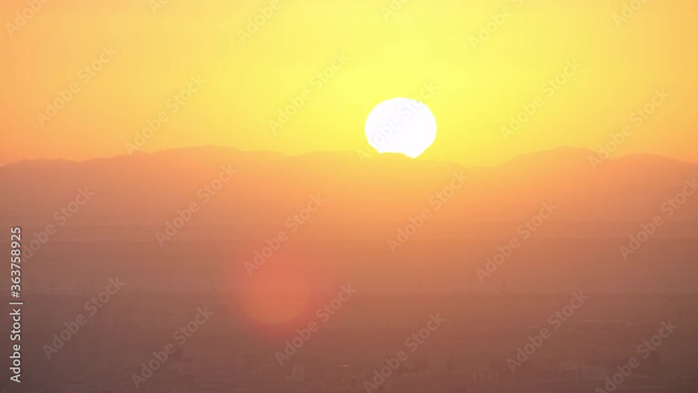Stunning Sunset on Dubai skyline with magnificent orange and yellow colors. Zooming in and out helicopter, 6-axis stabilized gimbal,8K Stunning Sunset on Dubai skyline with magnificent orange and yellow colors. Zooming in and out helicopter, 6-axis stabilized gimbal,8K