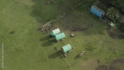 Old fashoned holiday homes on wagons, small get away stays on local farm in England photo