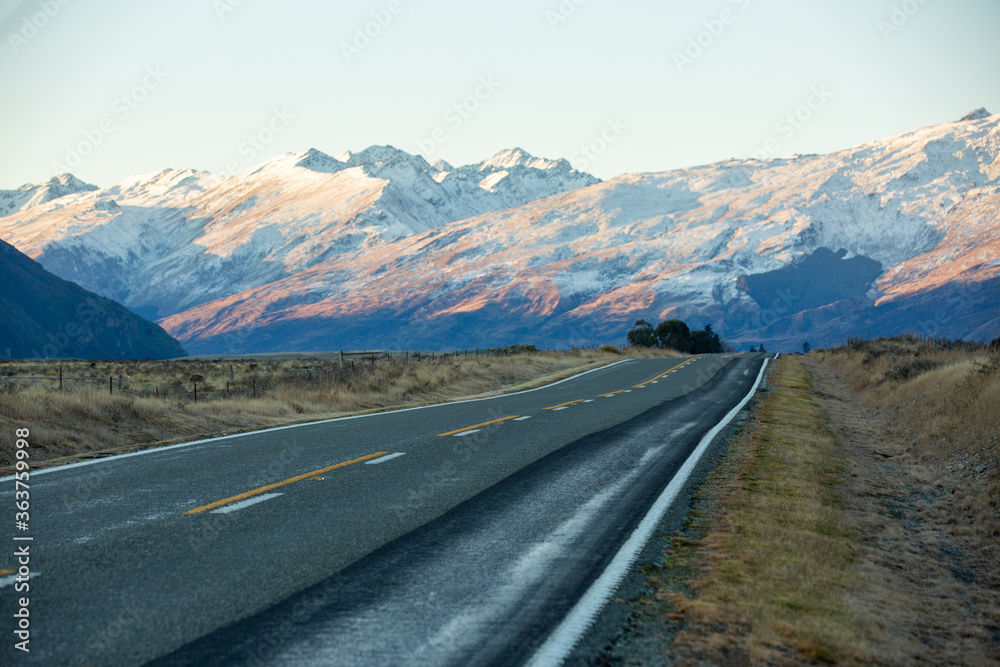 Most beautiful road to snow mountain in New Zealand during sunset.