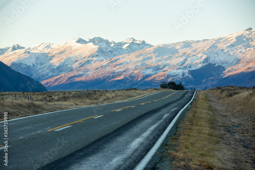 Most beautiful road to snow mountain in New Zealand during sunset.