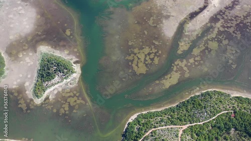 Prolosko Blato Jezero swamp area lake in Croatia near the Bosnian border, Aerial top view lowering shot photo