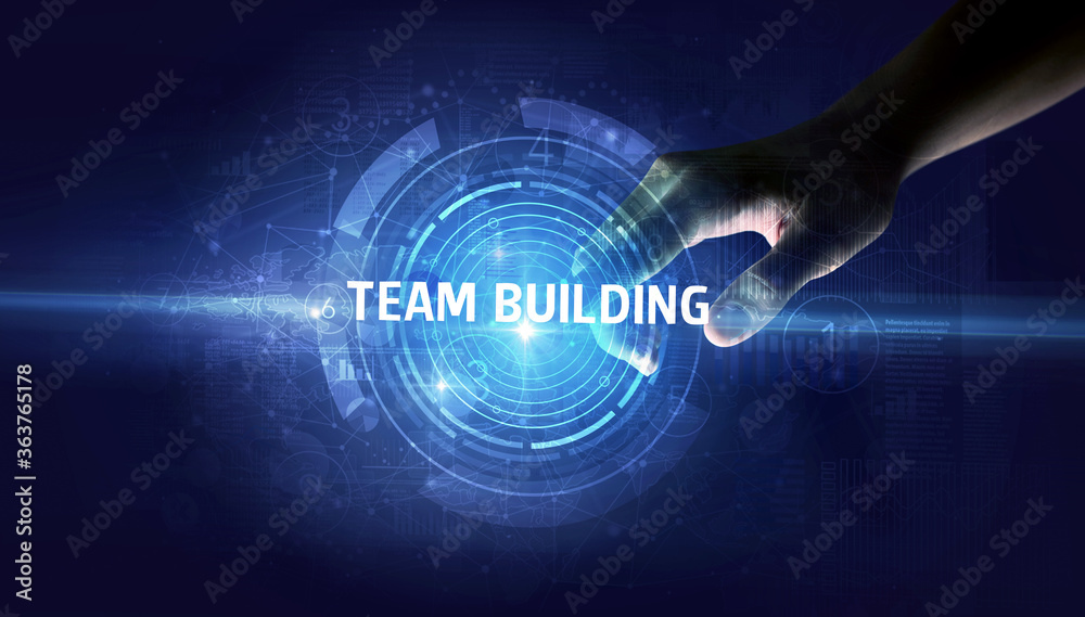 Hand touching TEAM BUILDING button, modern business technology concept