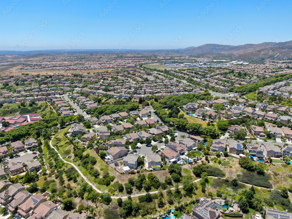 Aerial view of suburban neighborhood with big mansions in San Diego, California, USA. Aerial view of residential modern subdivision luxury house.