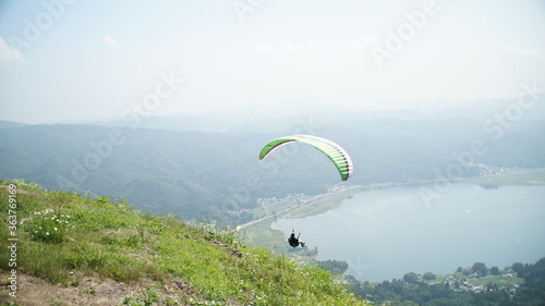 Fly over the lake Kizaki with a paraglider