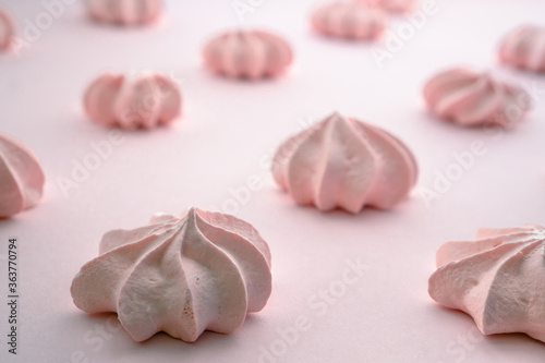 Pink meringue with rows on the same background