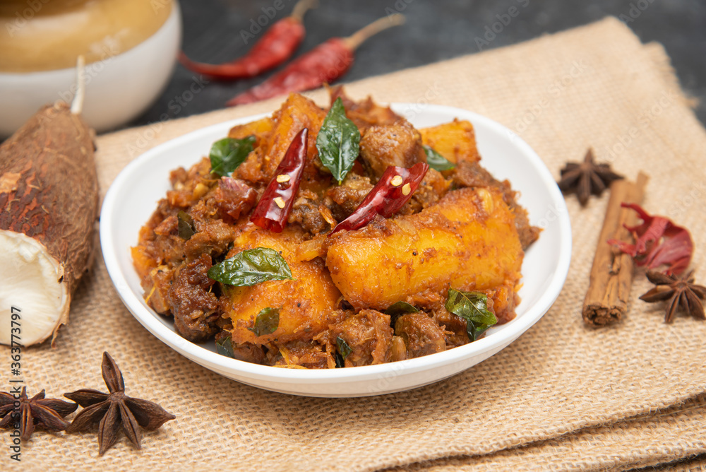 Popular traditional South Indian food Kappa or tapioca biryani hot and  spicy dish made with cooked organic cassava root, grated coconut, beef or  steak and Kerala, India. staple food Brazil. Stock Photo