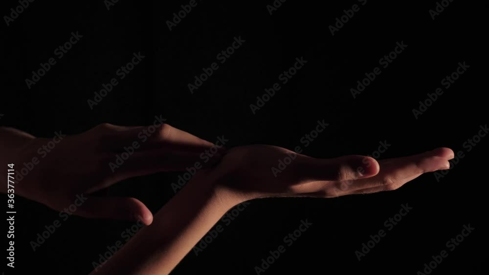 Close-up of female hands of a pianist moving chaotically on a black isolated background. Foot 3840x2160 (4K) shot in real time with artificial professional lighting Close-up of female hands of a pianist moving chaotically on a black isolated background. Foot 3840x2160 (4K) shot in real time with artificial professional lighting