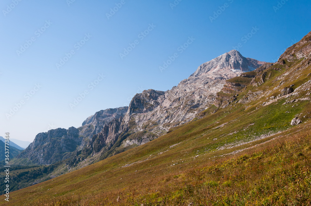 yellow rocky slope on the background of rocks yellow rocky slope on the background of rocks