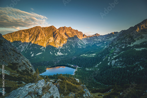 Sunset panorama in High Tatras mountains national park. Mountain popradske lake in Slovakia. photo