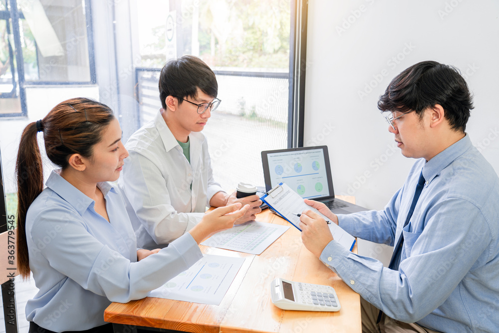 Fototapeta premium young Asian couple feeling happy and pleasant after received advice discussion about financial planning for investment at the meeting with financial advisor staff at home