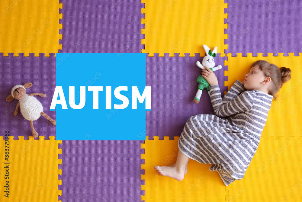 Little girl with autistic disorder lying on floor, top view Stock Photo Adobe Stock
