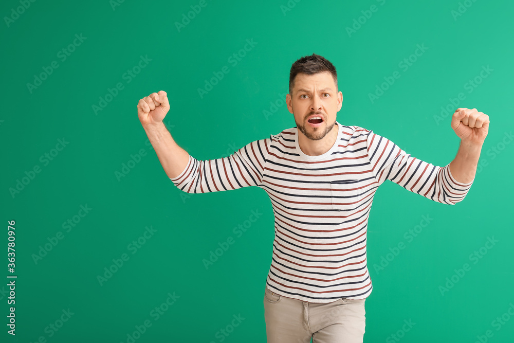 Protesting aggressive man on color background Protesting aggressive man on color background