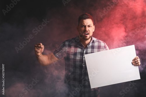 Protesting man with blank p...