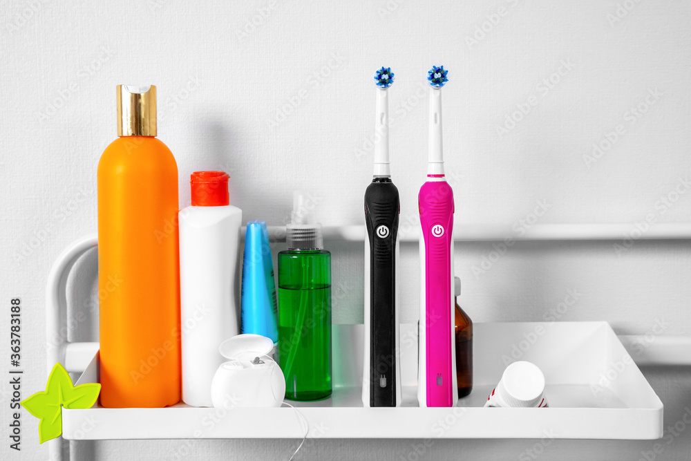 There are dental floss in box, toothpaste, two electric toothbrushes