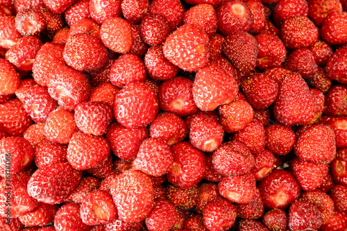 Image of red tasty strawberries. Side view. Closeup