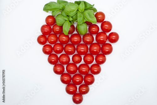 strawberry shaped tomatoes with basilicum on top