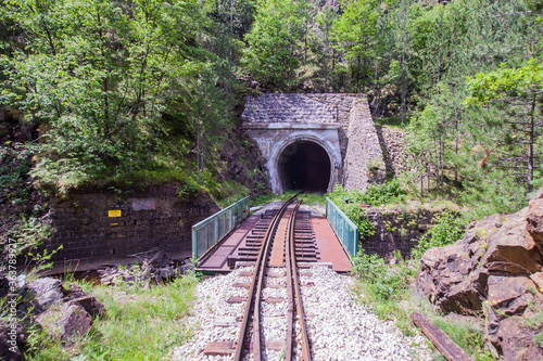 Old railway tunnel on Narrow-gauge railway, Tourist Attraction, old-fashioned travel photo