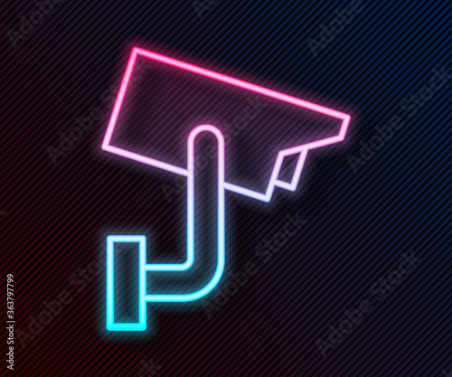 Glowing neon line Security camera icon isolated on black background. Vector Illustration.