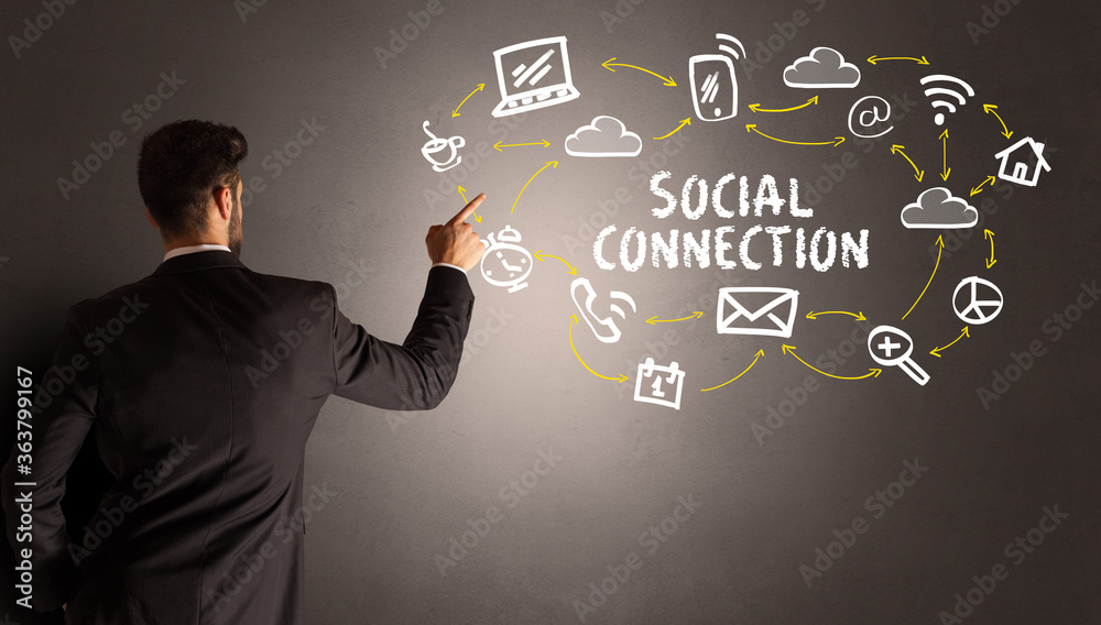 businessman drawing social media icons with SOCIAL CONNECTION inscription, new media concept businessman drawing social media icons with SOCIAL CONNECTION inscription, new media concept
