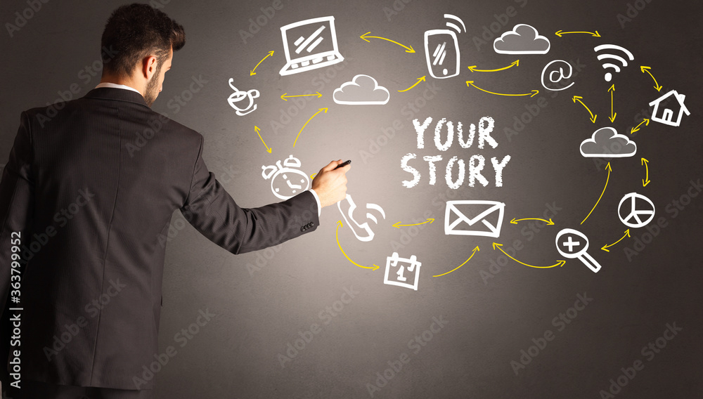 businessman drawing social media icons with YOUR STORY inscription, new media concept businessman drawing social media icons with YOUR STORY inscription, new media concept