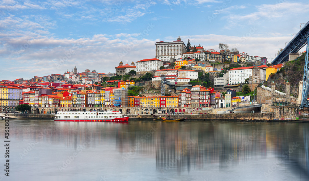  Porto at day with reflection in Douro river. Portugal